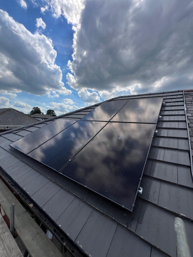 Solar PV panels mounted on roof tiles, side angle view