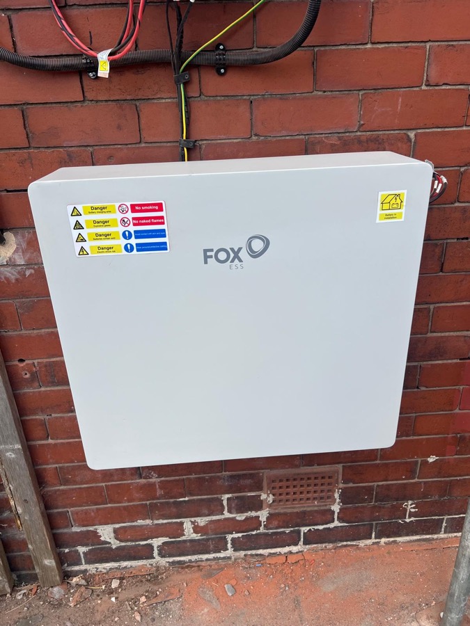 FoxESS battery storage unit close-up, wall-mounted